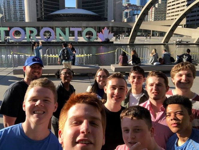Penn State students at the Toronto sign in front of Toronto's City Hall