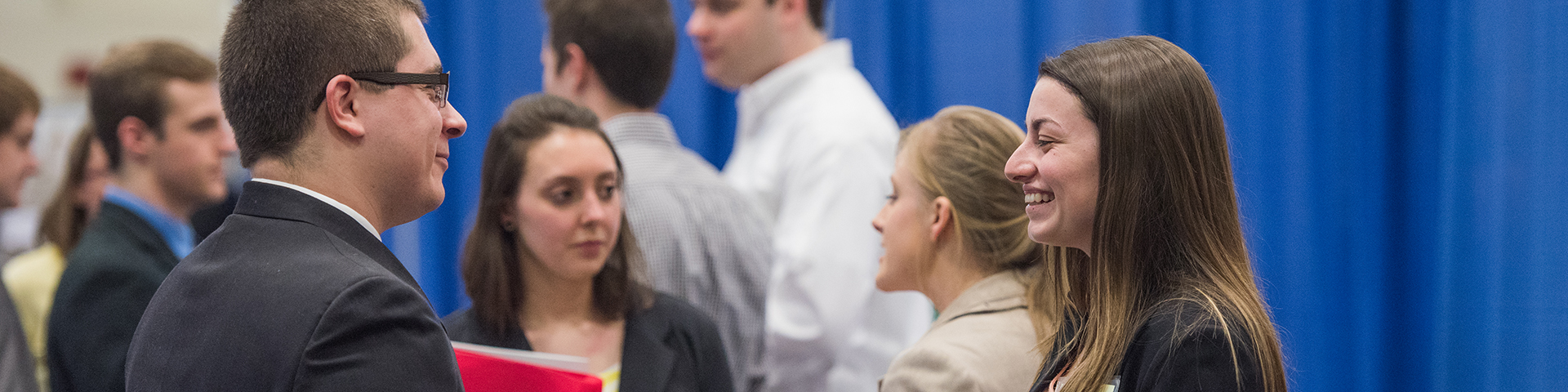 Students talking with potential employers at a Career and Internship Fair